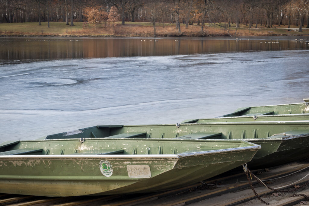 Green jon boats at dock